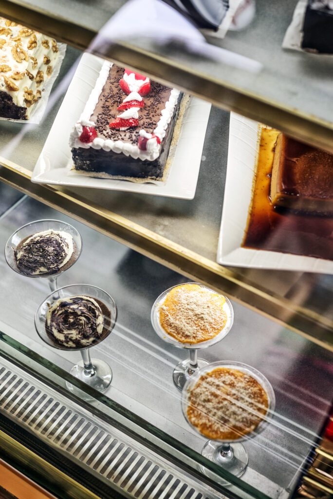 mixed portuguese traditional cakes and sweet desserts in cafe display portugal